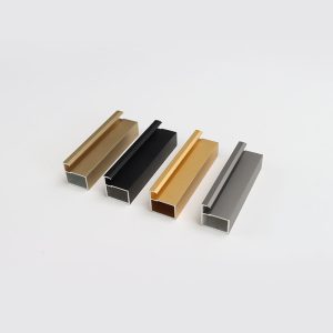 Four rectangular metal channel profiles in gold, black, gold, and gray