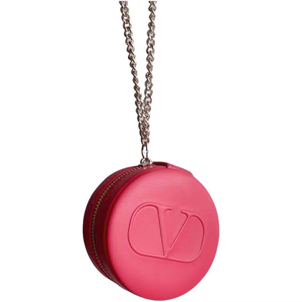 Looking for a macaron-inspired accessory that doubles as a necklace and a makeup case?